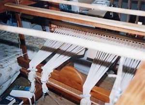 Crete. Weaving. Loom. Tensioning warp.